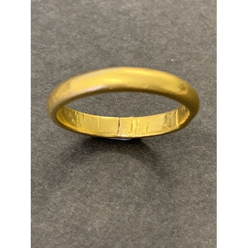 192 - A 22ct gold band, approx. size O, weight approx. 4.5g (ring out of shape and damage to inside of sha... 