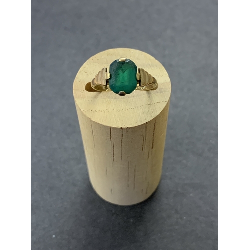 195 - A 9ct gold and green stone set ring, approx. size N 1/2, weight approx. 2.8g (stone very scuffed)