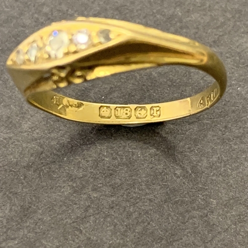 199 - An 18ct gold and diamond set ring, approx. size N 1/2, weight approx. 2.4g