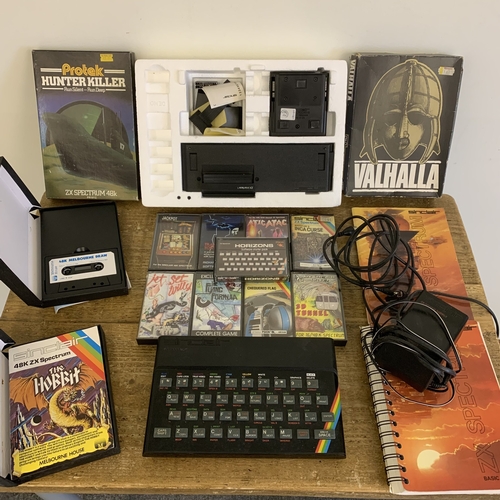 209 - A vintage Sinclair ZX Spectrum together with booklet and games plus a separate ZX Interface 1 (all u... 