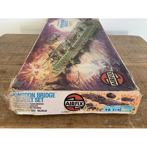 215 - An Airfix Pontoon Bridge Assault set (contents appear complete, mild playwear, box with damage) toge... 