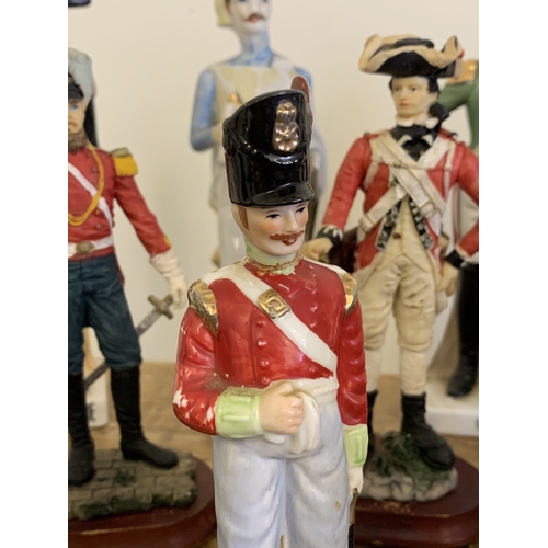 231 - A selection of approx. 25 ceramic and resin 19th Century style military figurines, the tallest just ... 