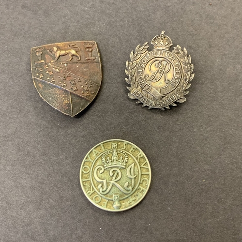 233 - A hallmarked silver Royal Engineers sweetheart brooch plus a 'For Loyal Services' badge and a shield... 