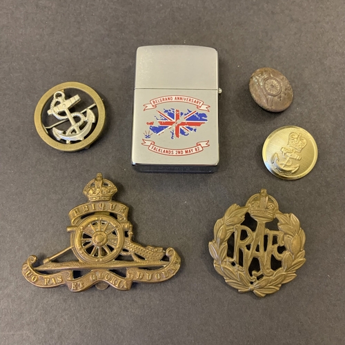 235 - Two vintage cap badges, a Navy badge, Zippo Belgrano Anniversary lighter etc