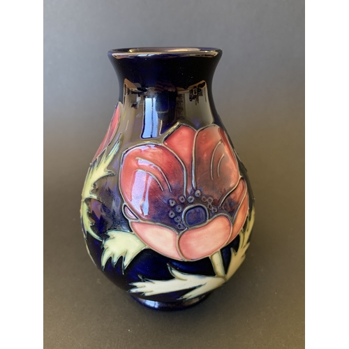 25 - A Moorcroft blue ground vase in the 'Anemone' pattern, reissued in 1988 and having the 34/94 stamp t... 