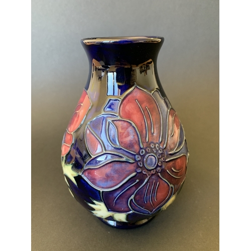 25 - A Moorcroft blue ground vase in the 'Anemone' pattern, reissued in 1988 and having the 34/94 stamp t... 