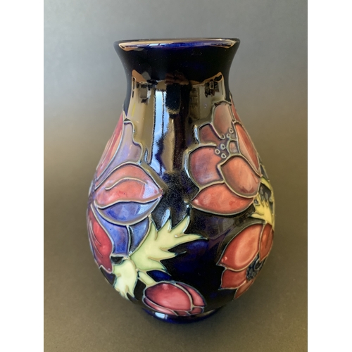 25 - A Moorcroft blue ground vase in the 'Anemone' pattern, reissued in 1988 and having the 34/94 stamp t... 