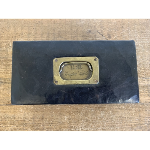 250 - An antique leather covered jewellery box with lift out tray, brass handle with engraved back plate '... 