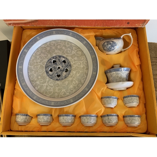 256 - A boxed vintage Chinese ceramic tea set plus six rice bowls, spoons and boxed chop sticks