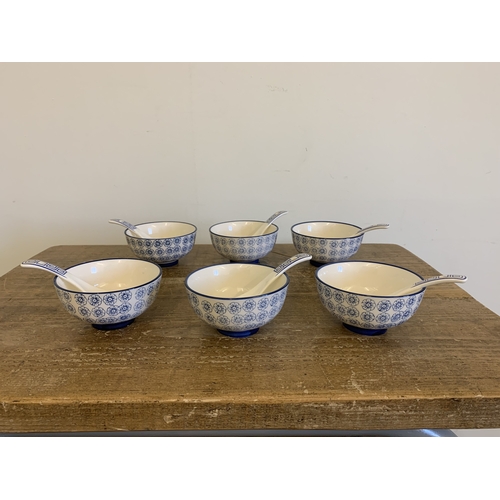 256 - A boxed vintage Chinese ceramic tea set plus six rice bowls, spoons and boxed chop sticks