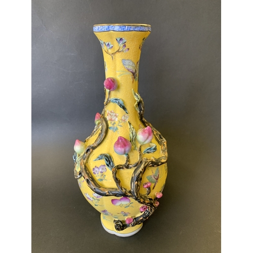 259 - A Chinese Imperial style yellow ground vase decorated with vines and flowers, Chinese character seal... 