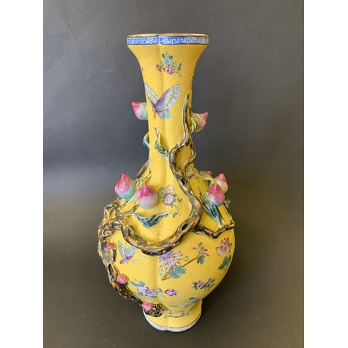 259 - A Chinese Imperial style yellow ground vase decorated with vines and flowers, Chinese character seal... 