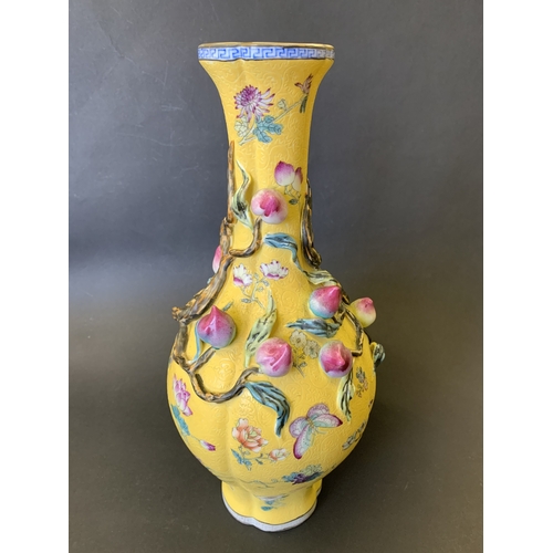 259 - A Chinese Imperial style yellow ground vase decorated with vines and flowers, Chinese character seal... 