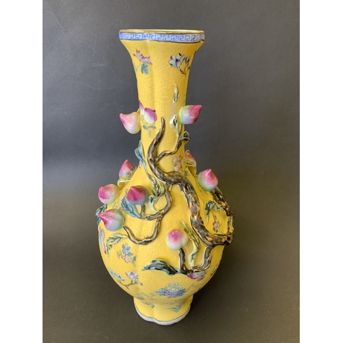 259 - A Chinese Imperial style yellow ground vase decorated with vines and flowers, Chinese character seal... 