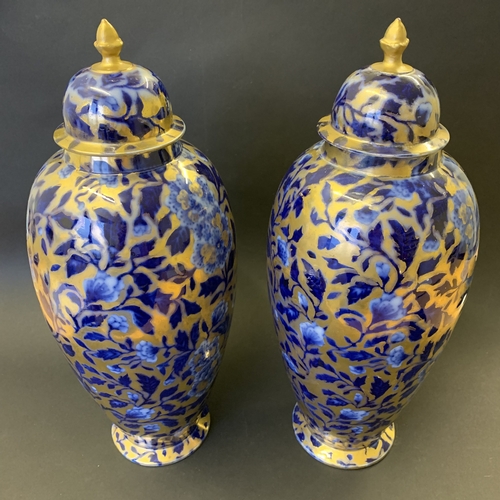 266 - A pair of vintage covered vases decorated in cobalt blue and gilding, no marks to base, approx. 15 3... 