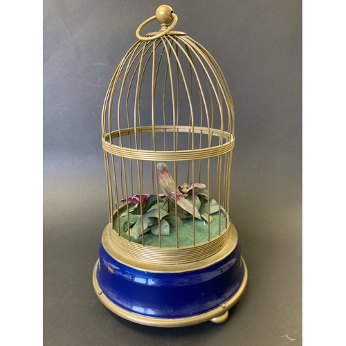 268 - A semi-modern reproduction music box with singing bird and wind-up movement, approx. 12