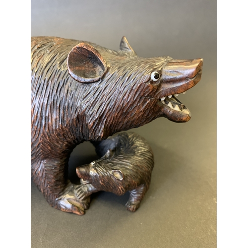 269 - A Black Forest style bear and cub, both with glass eyes, 7