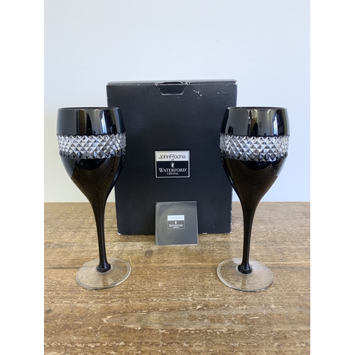 279 - A boxed Waterford Crystal pair of black wine glasses by John Rocha