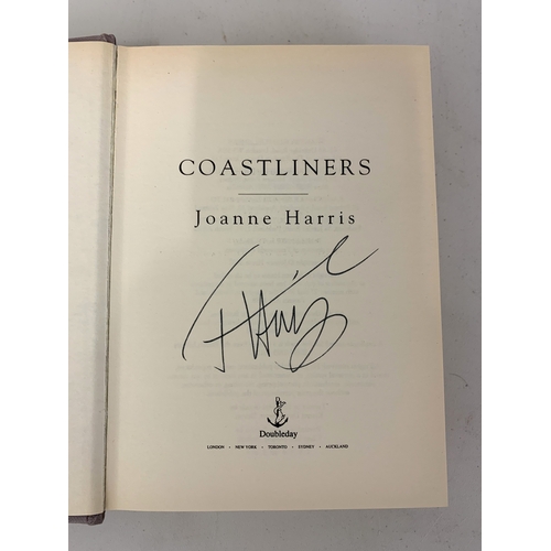 297 - Various mixed books including dragon subjects, a signed Joanne Harris 'Coast Liners' U.S.A. edition,... 