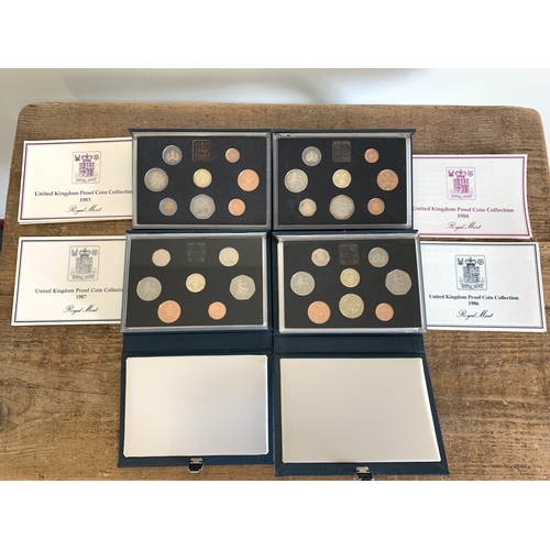 312 - Four cased proof coin collections, 1983, 1984, 1986 and 1987