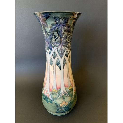 32 - A Moorcroft vase in the 'Cluney' pattern, designed by Sally Tuffin, approx. 12