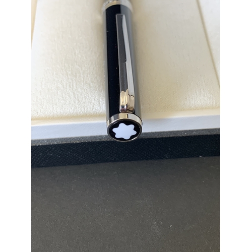 325 - A boxed Mont Blanc MB114797 pen complete with box, warranty card and service guide, the pen had been... 