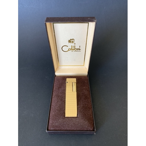 326 - A boxed vintage Colibri London gold finish lighter (signs of use)