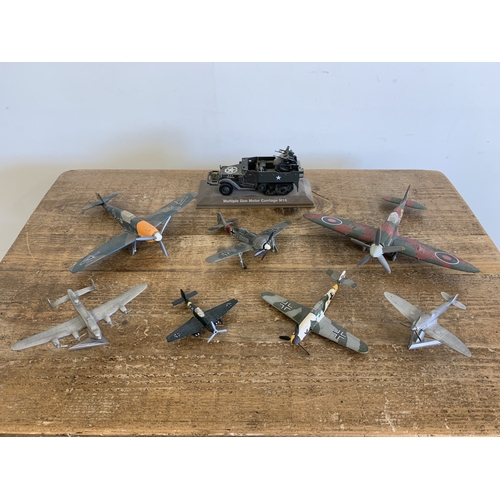 367 - A selection of constructed plastic aircraft with metal examples plus a tin plate multiple gun motor ... 