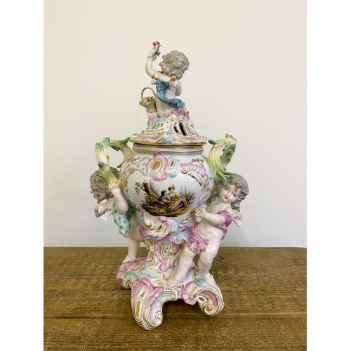 50 - An early 20th Century Dresden putti lidded jar, garlands of applied flowers and hand painted decor (... 