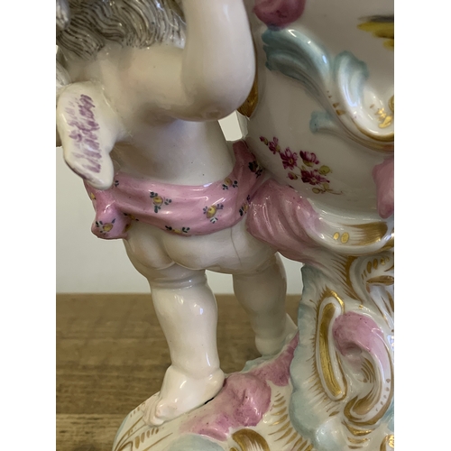 50 - An early 20th Century Dresden putti lidded jar, garlands of applied flowers and hand painted decor (... 