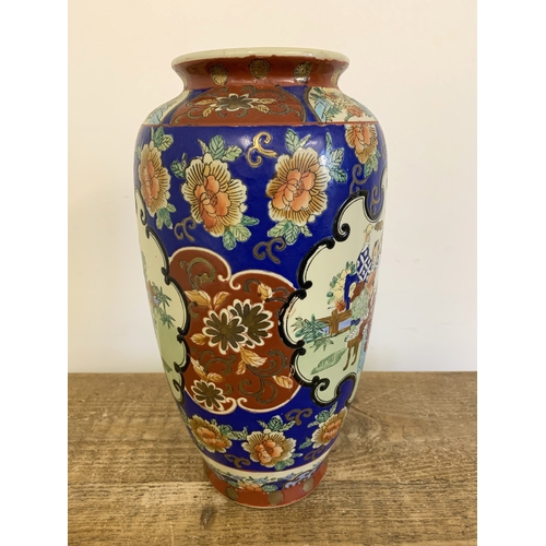 57 - A vintage Oriental hand painted vase, approx. 13 3/4