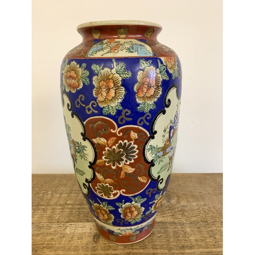 57 - A vintage Oriental hand painted vase, approx. 13 3/4