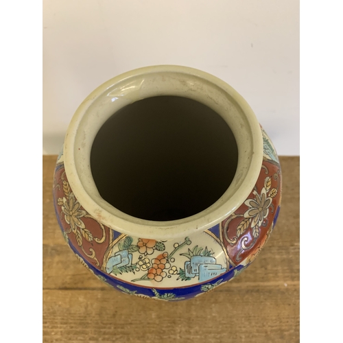 57 - A vintage Oriental hand painted vase, approx. 13 3/4