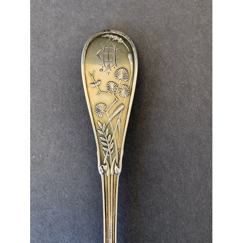 284 - A Tiffany sterling silver small ladle/spoon beautifully decorated in the Japanese pattern with a bir... 