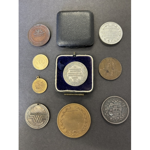 114 - A collection of corporate advertising and exhibition medallions and medals