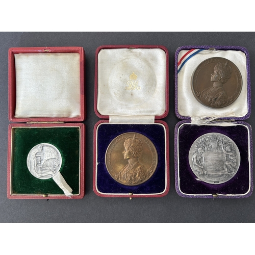 122 - Two official George V Coronation medallions and two others, both in original cases