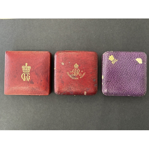 122 - Two official George V Coronation medallions and two others, both in original cases