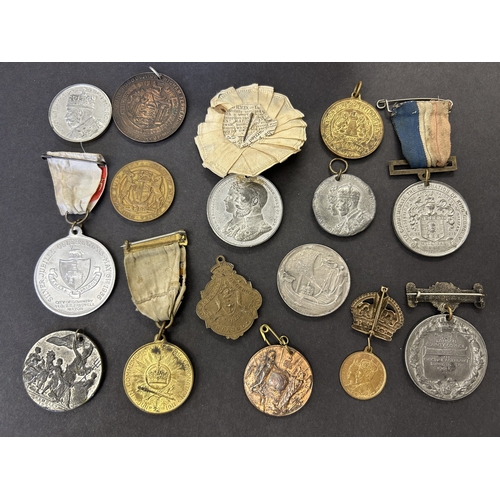 123 - A collection of George V commemorative medals and medallions including 1921 visit to Jersey