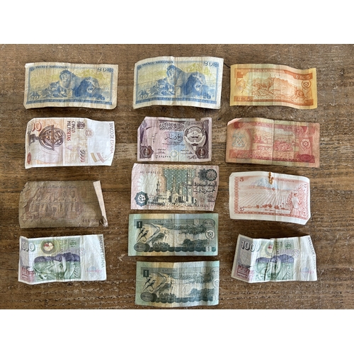 133 - Thirteen mixed banknotes to include Bank of Kenya, Bank of Kuwait, Bank of Ethiopia and Spanish