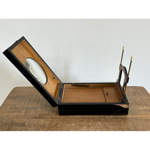 16 - A Victorian ebony veneered stereo-card box viewer (damage to corners)