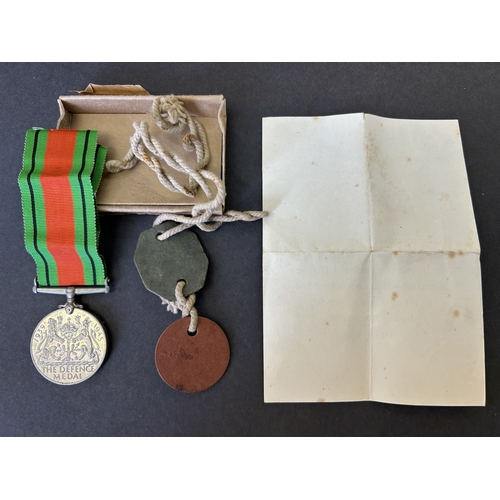 203 - WW2 Defence medal in box of issue to E Starling together with his dog tags