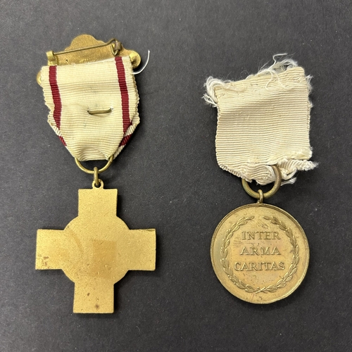 212 - BRCS medal for Red Cross First Aid, BRCS medal for Great War service and a BRCS badge, all unnamed