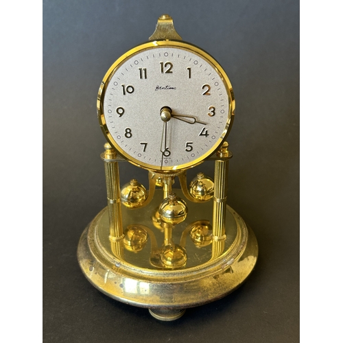 226 - A vintage 'Bentima' anniversary clock under glass dome, approx. 7