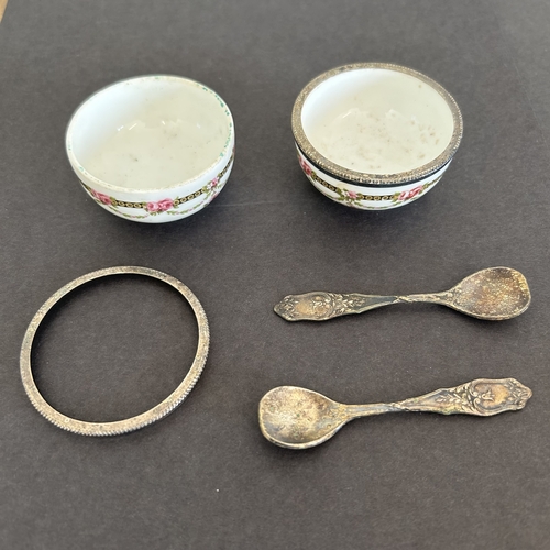 227 - A boxed Limoges porcelain pair of salts with white metal rims and spoons (one rim loose and one hing... 