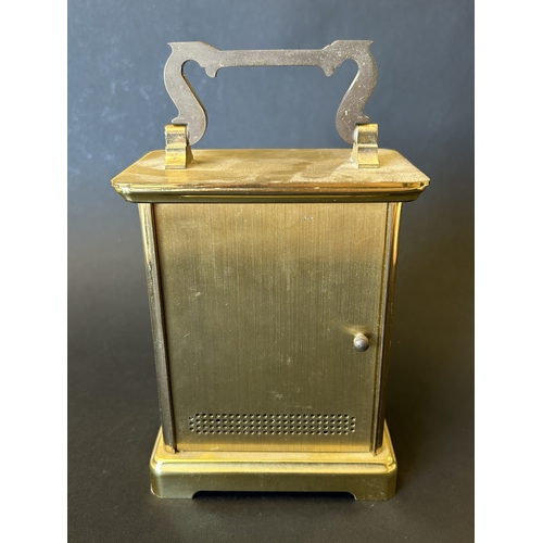 229 - An Acctim battery operated carriage clock in a brass finish, 7 3/4