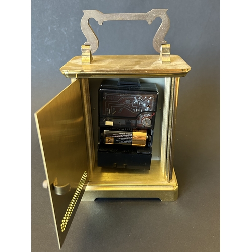 229 - An Acctim battery operated carriage clock in a brass finish, 7 3/4