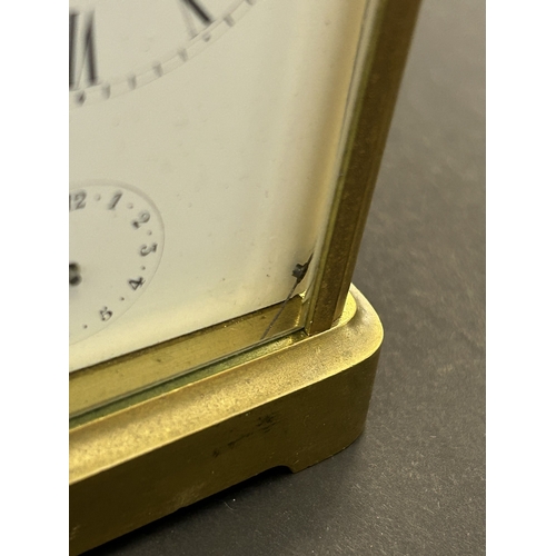 234 - A vintage brass cased chiming carriage clock with key, approx. 5 3/4