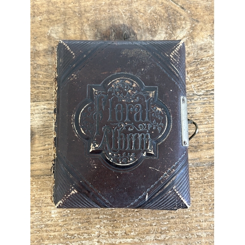 242 - An antique small photograph album, nearly full of photos with leather covered outer (old repair to s... 