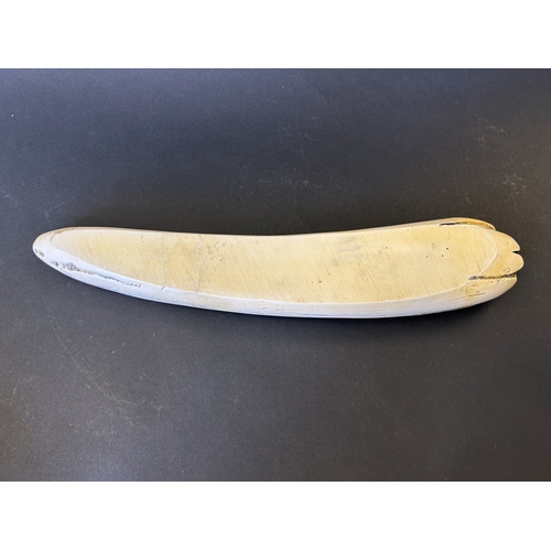 243 - A boxed resin copy of a marine scrimshaw tusk in the form of a crib board, based on the 1797 design ... 