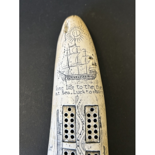 243 - A boxed resin copy of a marine scrimshaw tusk in the form of a crib board, based on the 1797 design ... 